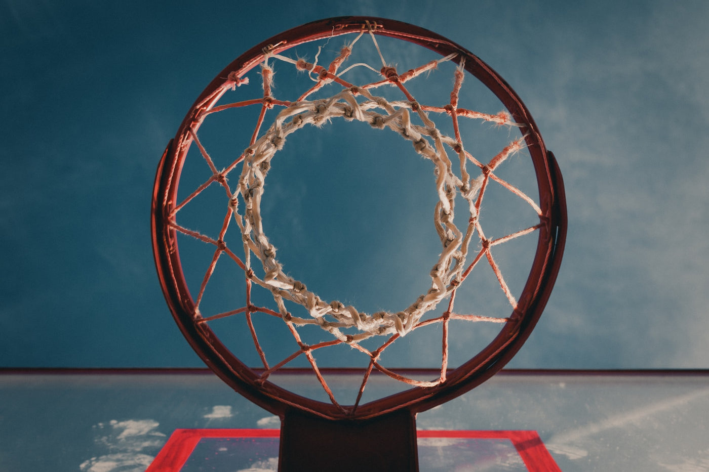 looking up at a basketball hoop