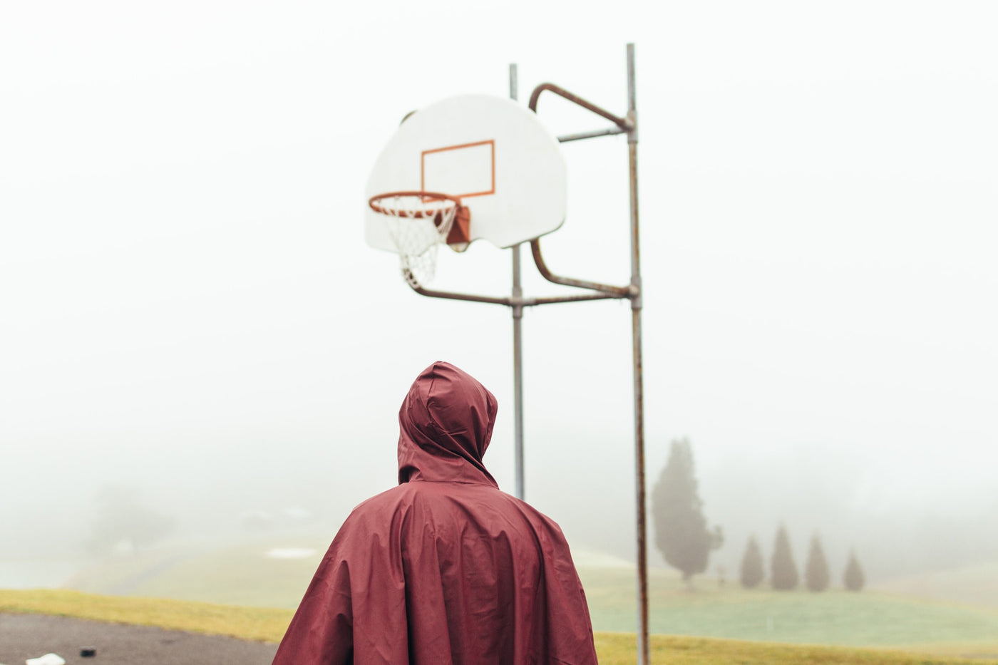 person standing in front of a basketball hoop